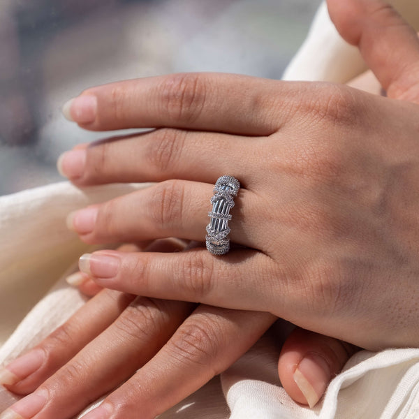 Minifora's signature Art Deco-inspired stacked ring adorning a hand, featuring multiple bands of 14K white gold, intricately set with lab-created diamonds.