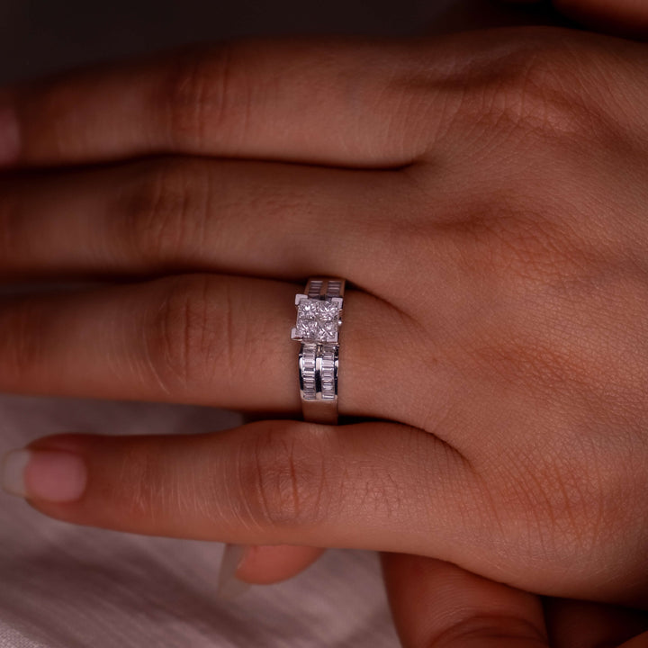 Hand modeling Minifora's Bold Brilliance ring, featuring a prominent lab-created princess-cut diamond centerpiece set in a sleek 14K white gold band. The band's channel-set baguette diamonds enhance the central stone's sparkle.