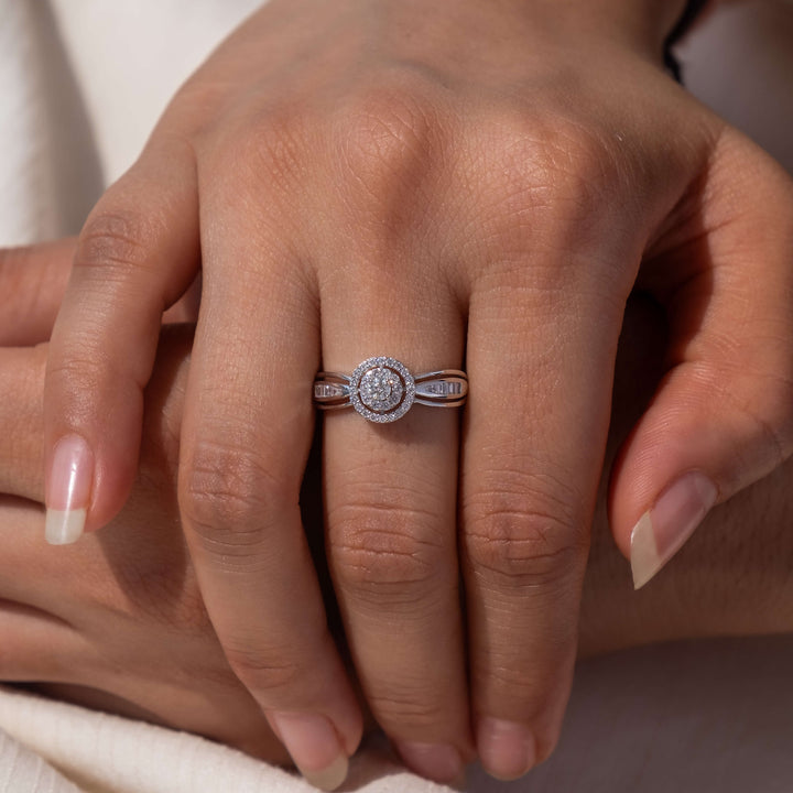 Minifora's Circle of Love Halo Diamond Ring is presented on a hand, showcasing a captivating halo of lab-created diamonds encircling a central gem. The ring's band, crafted in 14K white gold, features distinctive side detailing. 