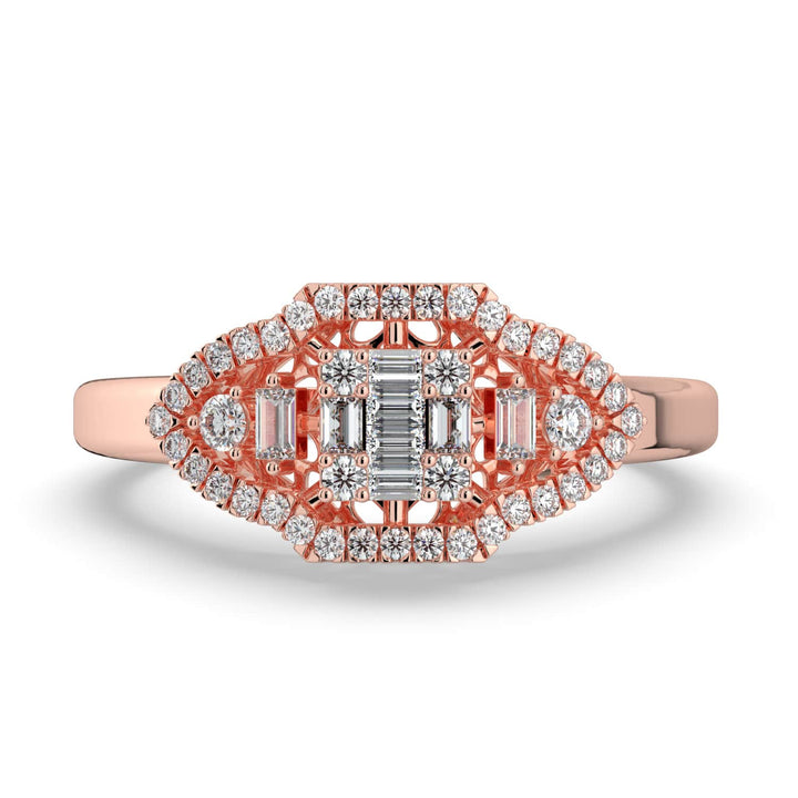 A vintage-inspired diamond ring featuring a combination of baguette and round diamonds in a marquise-shaped design, with a pavé-set halo and a polished band.