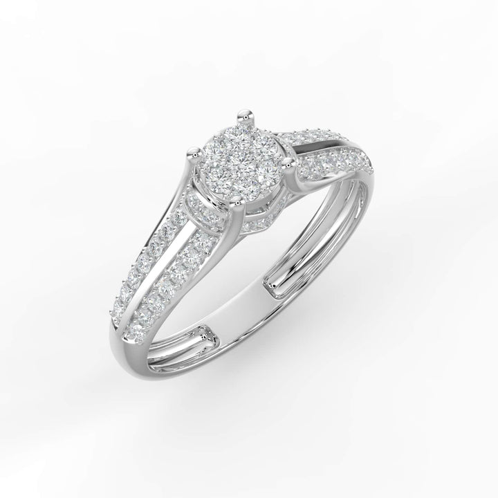 A diamond ring featuring a round cluster center with a split pavé-set diamond band, offering a classic and elegant design.