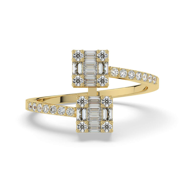 A modern diamond ring featuring two square clusters of baguette and round-cut diamonds on a pavé-set bypass band.