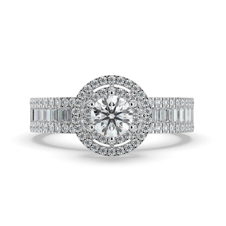 A diamond ring with a round center stone, surrounded by a double halo of pavé-set diamonds, and a band featuring a row of alternating baguette and round diamonds.