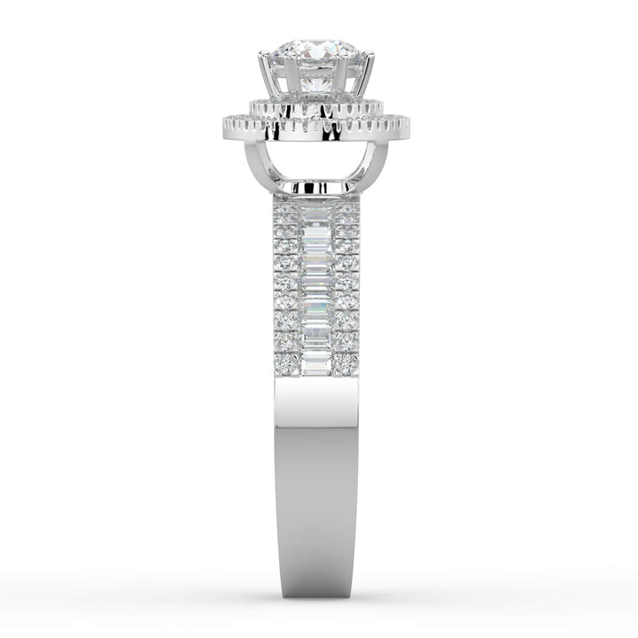 A diamond ring with a round center stone, surrounded by a double halo of pavé-set diamonds, and a band featuring a row of alternating baguette and round diamonds.