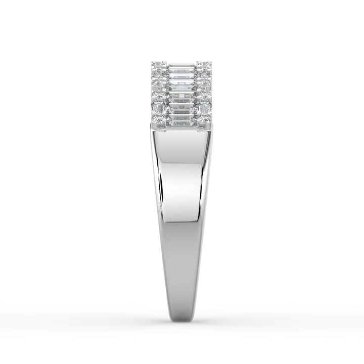 A diamond band featuring a row of alternating baguette and round-cut diamonds, set in a sleek white gold