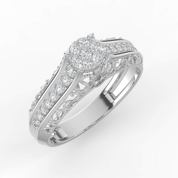 A diamond ring with a round cluster center and intricate filigree details along the band, adorned with pavé-set diamonds.